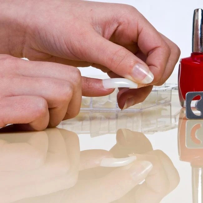 what removes nail glue from skin